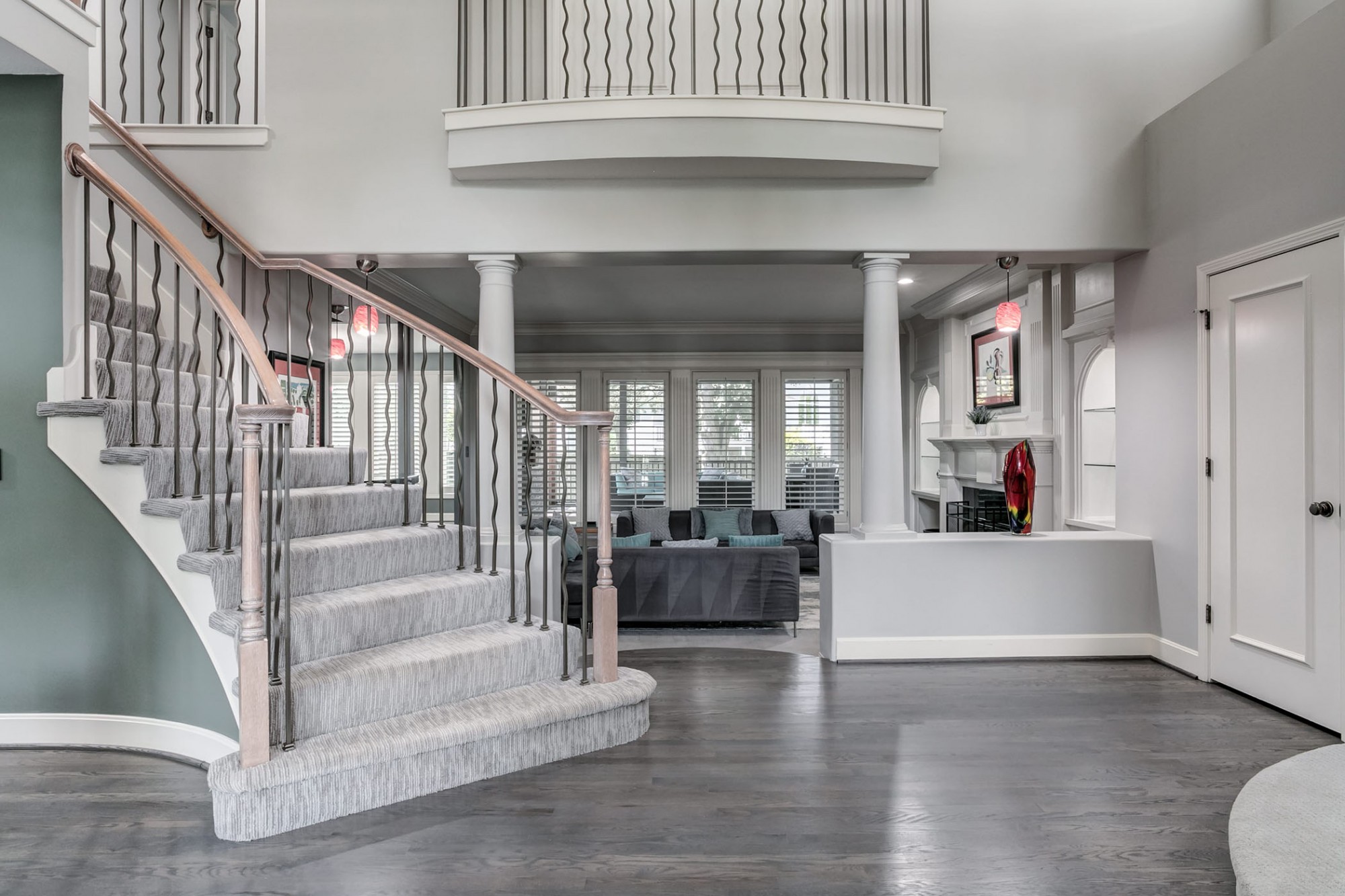 Gracious two story entry with grand staircase and updated pewter balusters