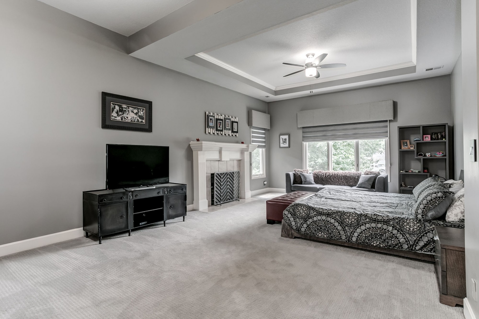Updated and massive master suite with fireplace and high-end window treatments.