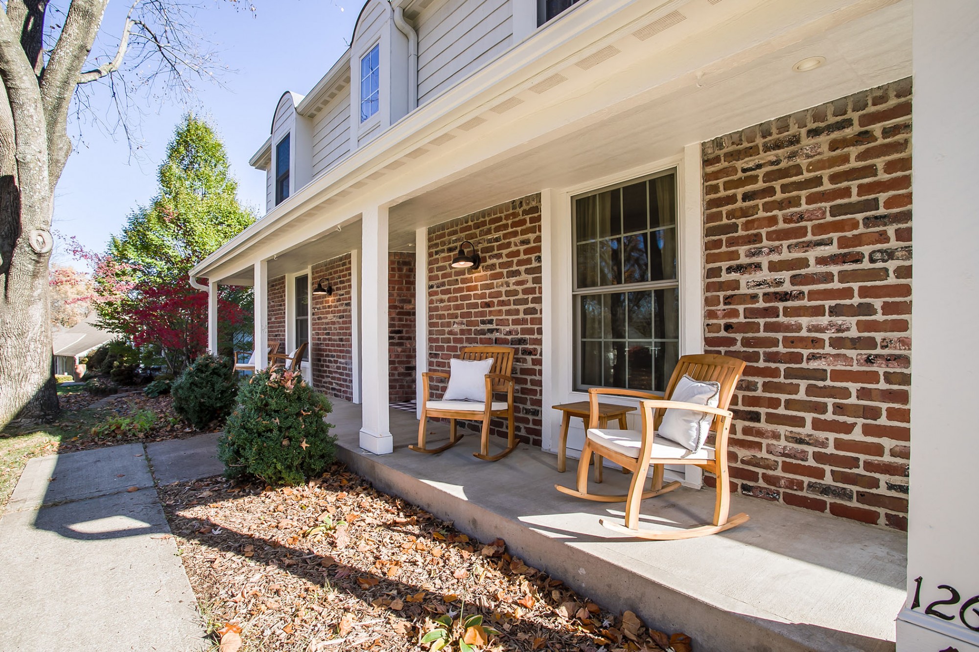 Enjoy a morning coffee, evening cocktail, or chat with a friend on this expansive rocking chair front porch.