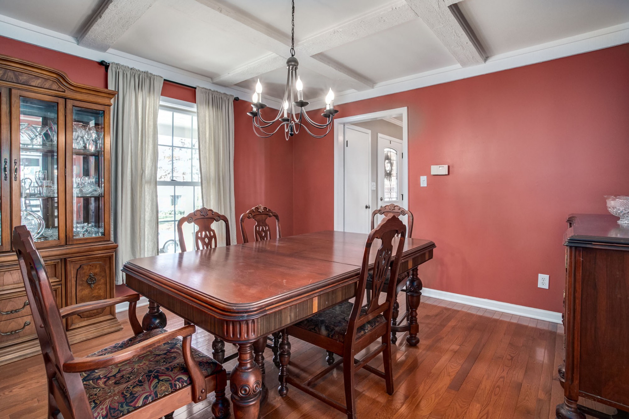 To the right of the foyer, the beautiful hardwood floors continue to the formal dining room.