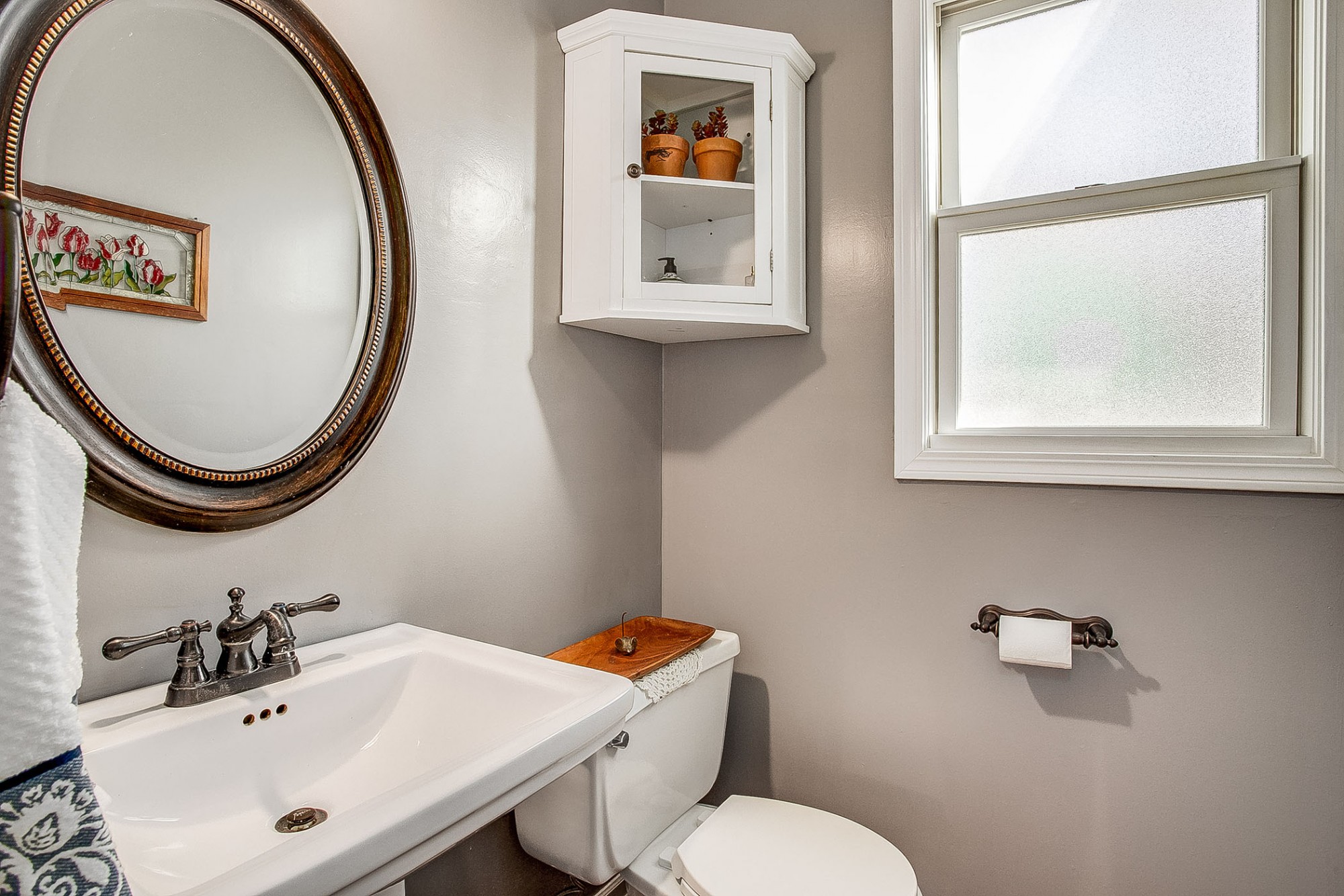 Delightful powder room for the convenience of your guests.