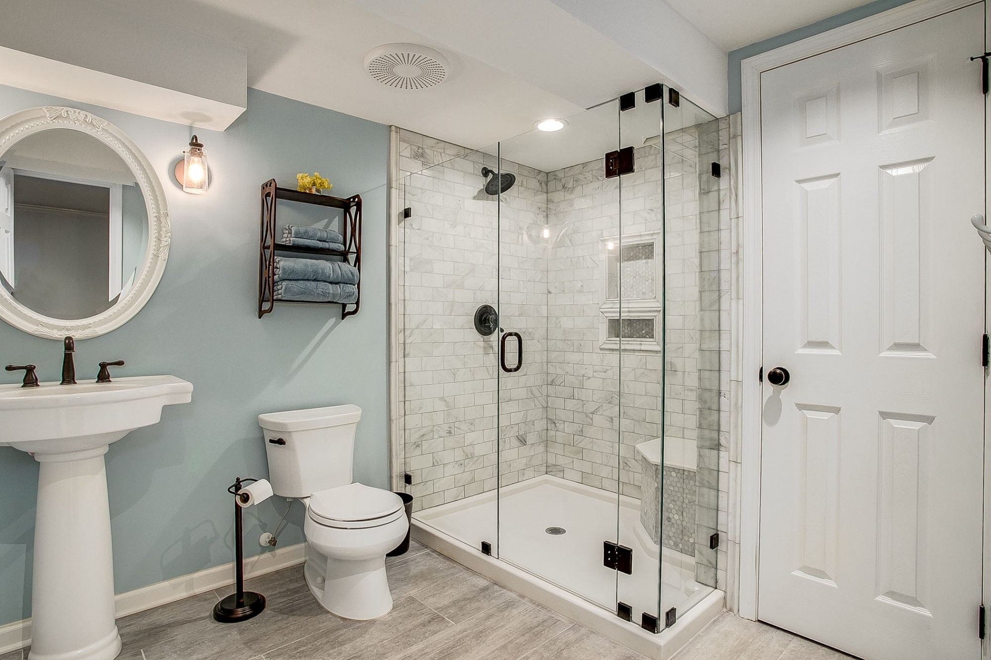 Gorgeous third full bath highlighting a stunning frameless glass and tile walk-in shower.