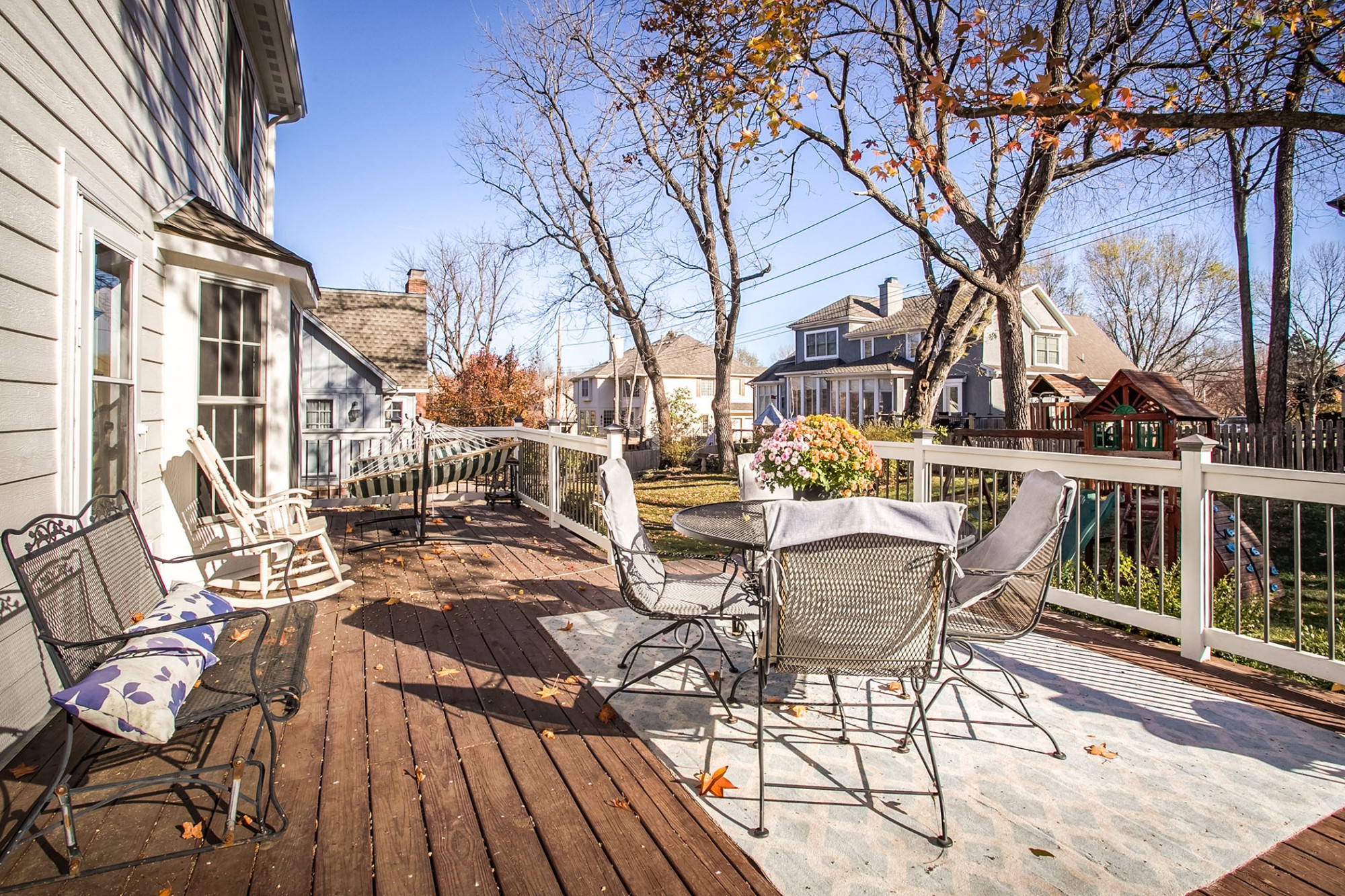 Relax on the huge 15x30 east facing deck, a wonderful spot to enjoy an evening barbecue and the views of the grassy backyard and swing set that stays.